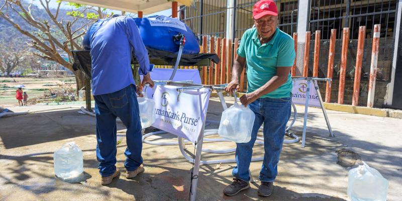Residents fill up at the water taps Samaritan’s Purse provided in Cumbres de Llano Largo.